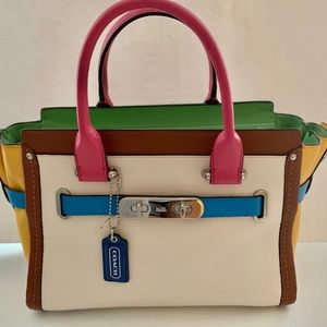 Coach Multicolor Handbag with matching strap.